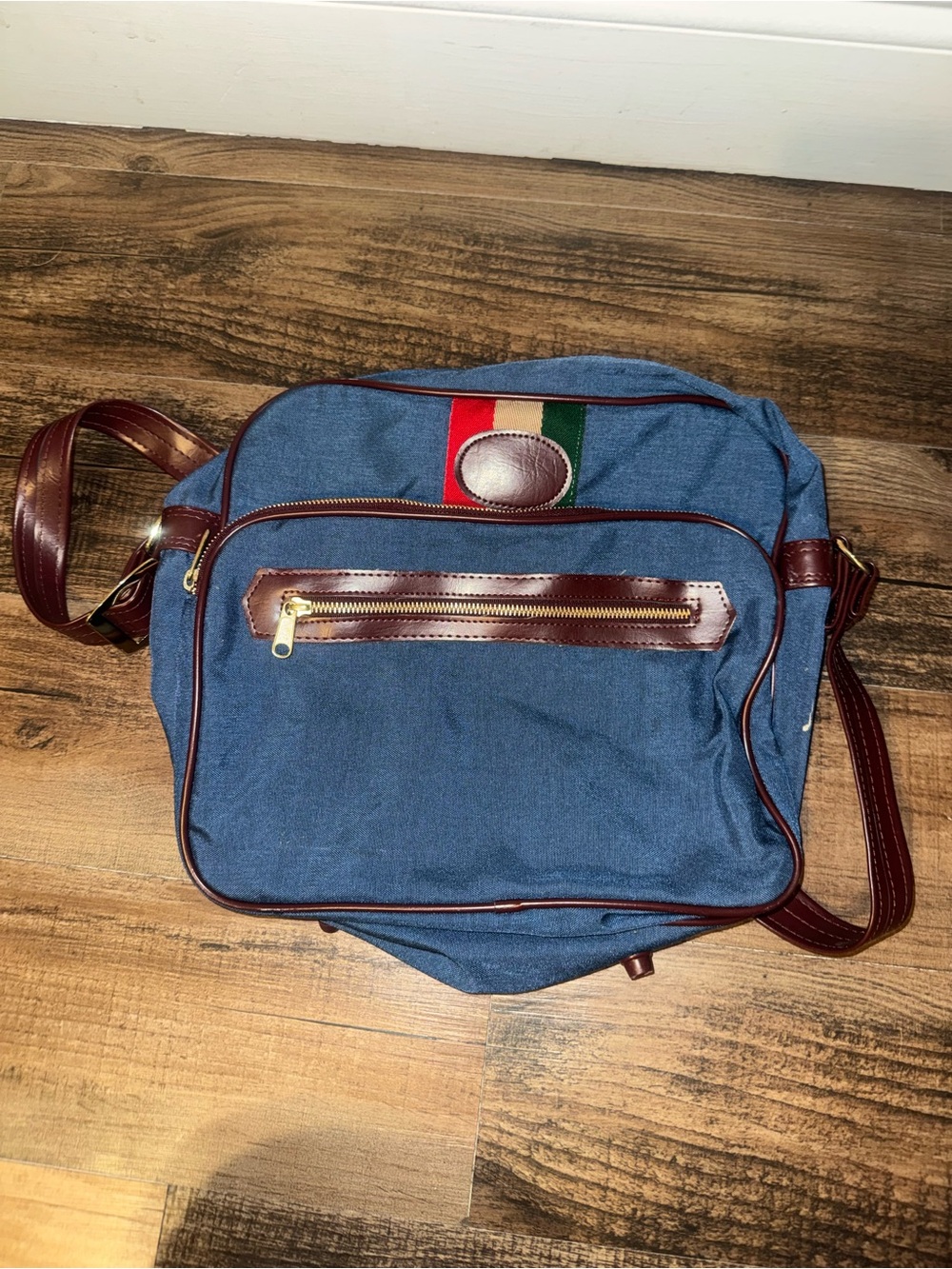 Blue Canvas Messenger Bag with Brown Trim and Stripe Accent
